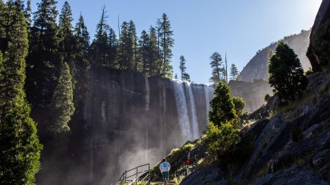 Visitors hike the Mist Trail toward Vernal Fall in Yosemite National Park in California. The park welcomed 3.67 million visitors in 2022.