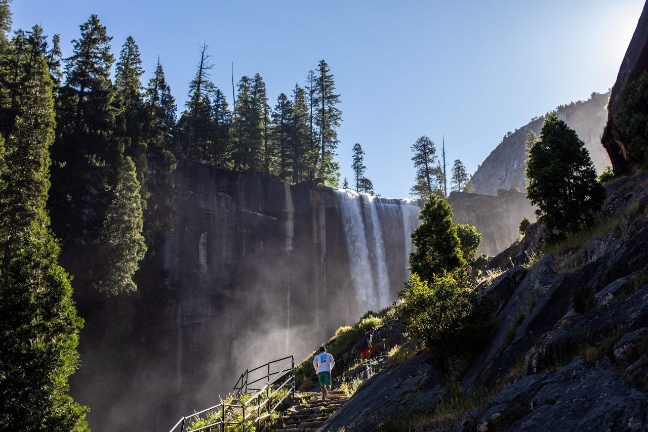 Visitors hike the Mist Trail toward Vernal Fall in Yosemite National Park in California. The park welcomed 3.67 million visitors in 2022.