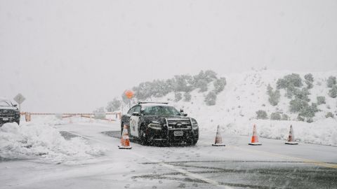Highway Patrol blocks Highway 39 due to blizzard conditions during a rare snowstorm Saturday in Los Angeles County.