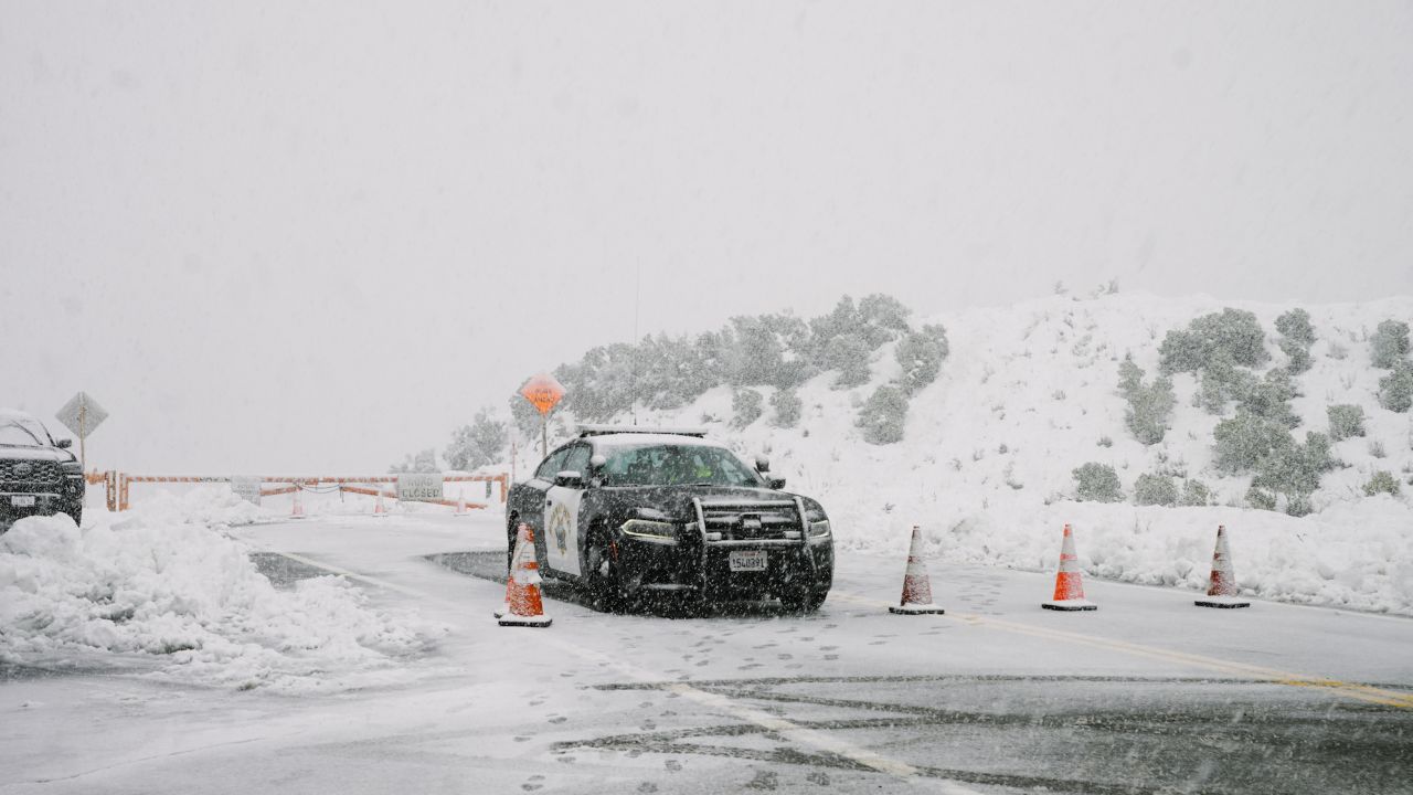 Highway Patrol blocks Highway 39 due to blizzard conditions during a rare snowstorm Saturday in Los Angeles County.