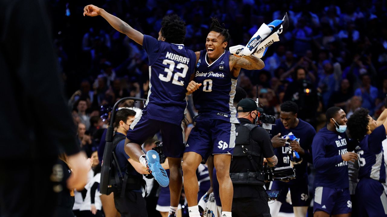 Jaylen Murray and Latrell Reid of the St. Peter's Peacocks celebrate after defeating the Purdue Boilermakers in the Sweet Sixteen round game of the 2022 March Madness.