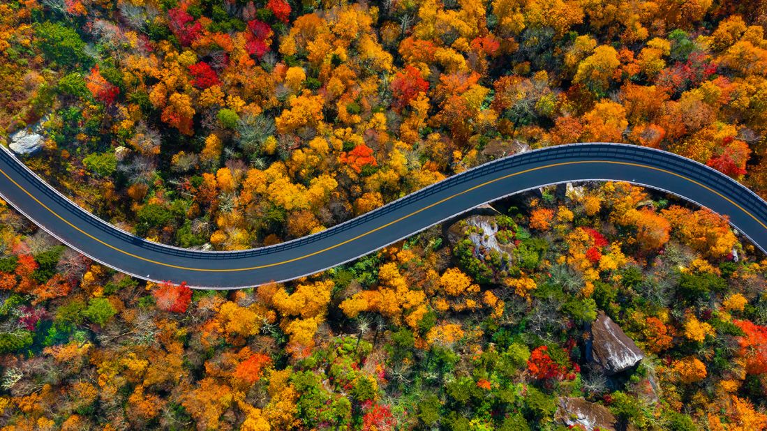 <strong>1. Blue Ridge Parkway:</strong> Fall colors vividly pop in this aerial photo of the parkway in the North Carolina portion of its route. (The parkway continues into Virginia). More than 15.7 million people paid recreational visits to the parkway in 2022, making it the No. 1 US National Park Service site.
