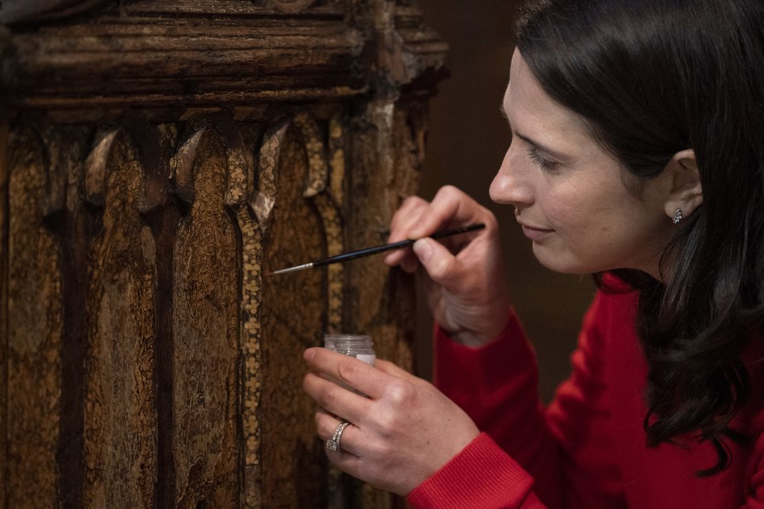 Conservator Krista Blessley works on the Coronation Chair at Westminster Abbey.