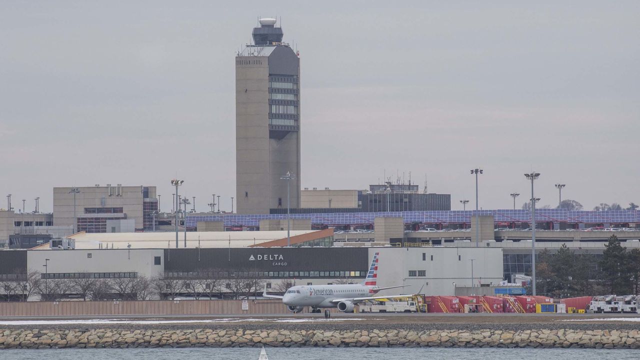 A photo taken in March 2019 shows the air traffic control tower at Boston Logan Airport. The airport was the site of a recent close call between a private jet and a JetBlue flight. 