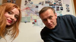 Selfie of Odessa Rae and Alexey Navalny in front of the suspect board. 