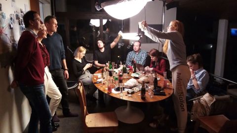 From left, Christo Grozev, Yulia Navalny, Alexey Navalny, Dasha Navalny, Daniel Roher, Georgy Alburov, Kira Yarmysh, Odessa Rae and Maria Pevchikh eat and unwind after 20 hours of filming the phone call and the CNN release.