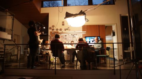 From left, Daniel Roher, Odessa Rae, Christo Grozev, Alexey Navalny and George Alburov gather around a table the day of the phone call.