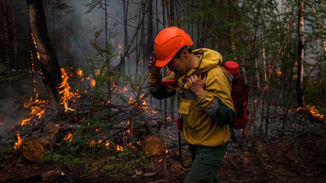 A member of Russia's Aerial Forest Protection Service pictured during wildfires in July 2021.