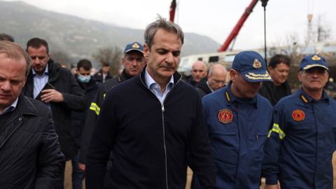Greek Prime Minister Kyriakos Mitsotakis visits the site of an accident on Wednesday.