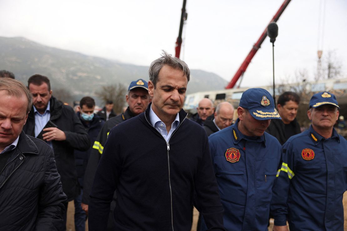 Greek Prime Minister Kyriakos Mitsotakis visits the site of a crash on Wednesday.