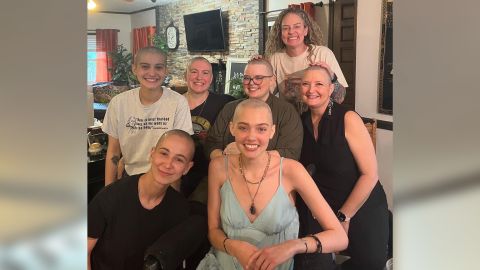 First row (from left):  Luba Omelchenko, a friend, and Claire Bridges. Second row (from left):  Andy Beaty, a friend; Jaye Scoggins, Beaty's mother; Anna Bridges-Brown, Claire's sister; and Kimberly Smith, Claire's mother.  Third row: Kristen Graham, a friend who shaved everyone's heads.