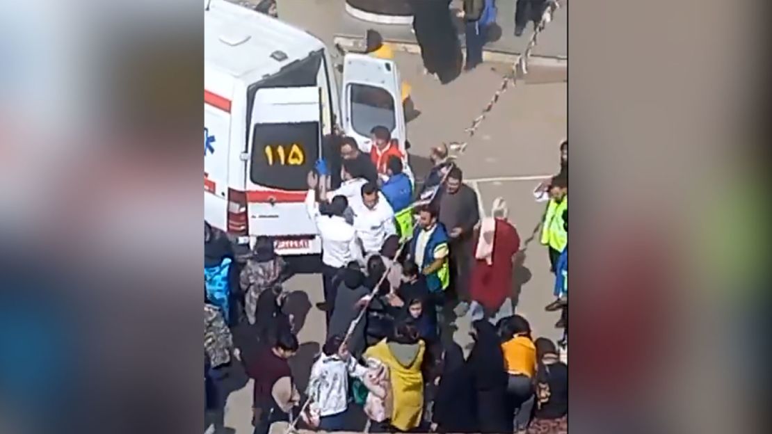 A medical team loads a patient onto ambulance in Halban Zaker Girls' School in the Iranian city of Ardabil.