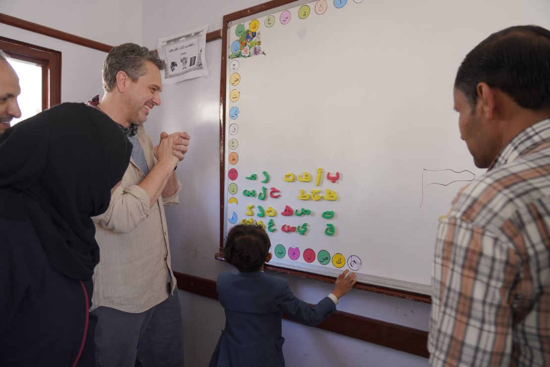 A student at a school in Hajjah, Yemen, run by War Child Canada/USA, teaches Thomas Sadoski Arabic.