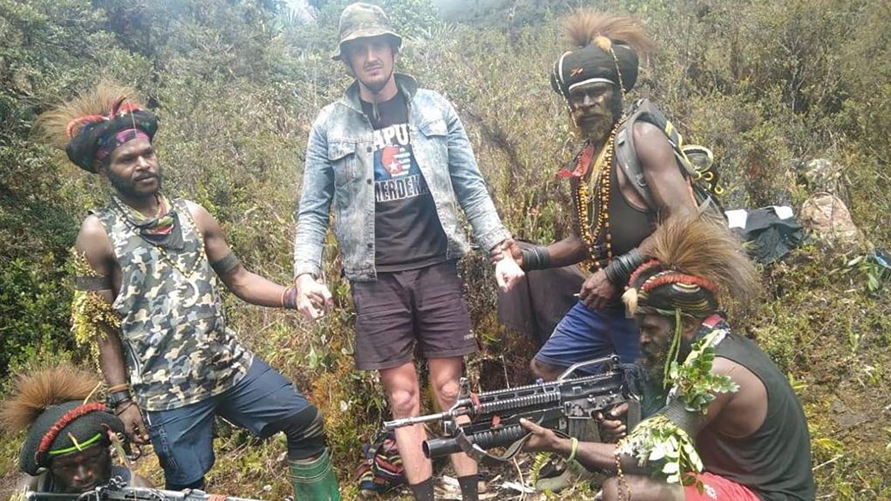 A man, identified as Philip Mehrtens, the New Zealand pilot held hostage by a pro-independence group, stands among the separatist fighters in Indonesia's Papua region, in this undated picture released by the The West Papua National Liberation Army on February 14.