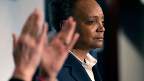 Chicago Mayor Lori Lightfoot pauses during her concession speech as her spouse Amy Eshleman applauds on Tuesday, February 28, 2023, in Chicago. 