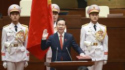 Vo Van Thuong, center, swears in as the president at the National Assembly in Hanoi, Vietnam Thursday, March 2, 2023.  Vietnam's legislative has approved Thuong to the presidency post, two months after former president Nguyen Xuan Phuc stepped down. (Nhan Huu Sang/VNA via AP)