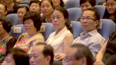 Yang Huiyan, center, attends an alumni event in the city of Foshan in Guangdong province in June 2016.
