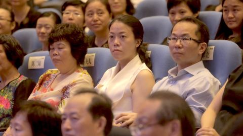 Yang Huiyan, center, attends an alumni event in the city of Foshan in Guangdong province in June 2016. 