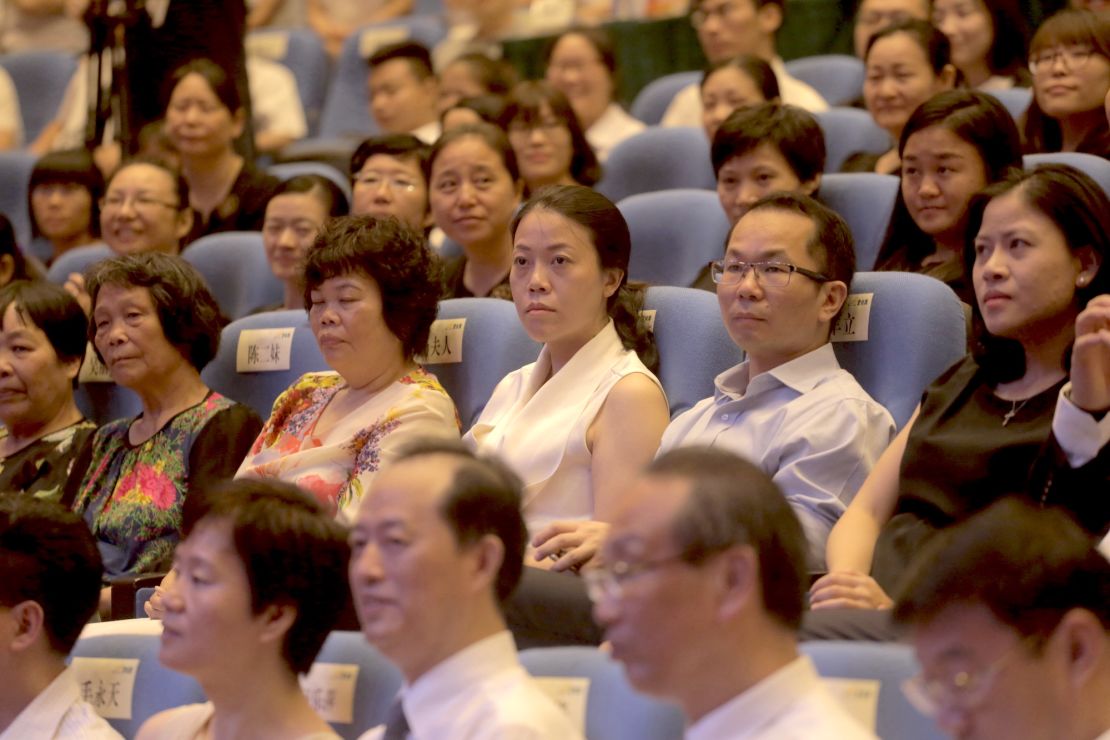 Yang Huiyan, center, attends an alumni event in the city of Foshan in Guangdong province in June 2016. 