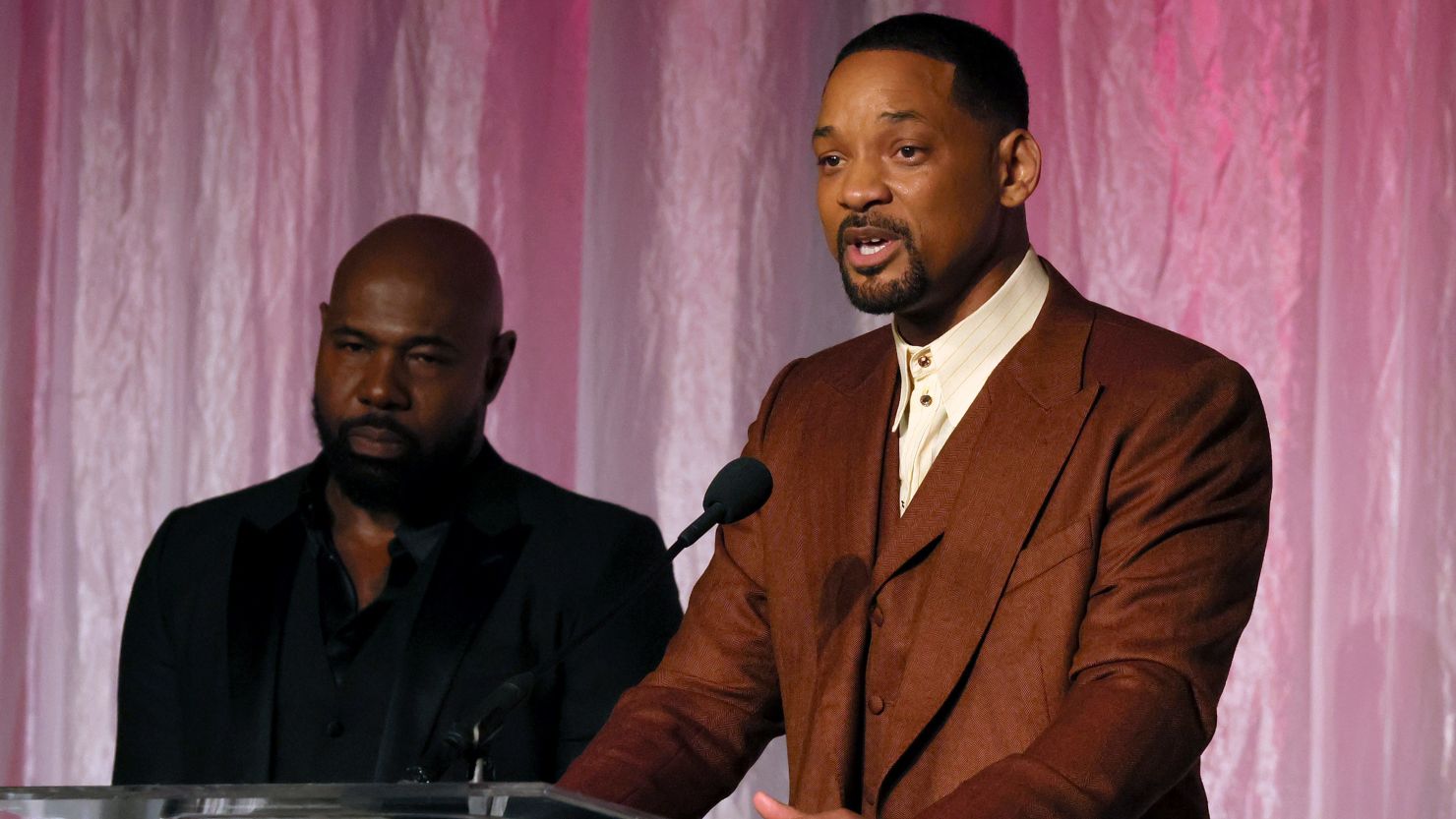 Honorees Antoine Fuqua (left) and Will Smith accept The Beacon Award for "Emancipation" onstage during the 14th Annual AAFCA Awards on Wednesday.