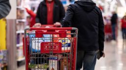 A customer pushes a shopping cart at a Target store on Black Friday in Chicago, Illinois, US, on Friday, Nov. 25, 2022. 