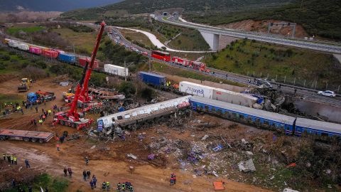 An aerial drone photograph taken on Wednesday shows emergency crews searching wreckage of the accident, which killed dozens and left scores injured.