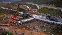 This aerial drone photograph taken on March 1, 2023, shows emergency crews searching wreckage after a train accident in the Tempi Valley near Larissa, Greece. - At least 32 people were killed and another 85 injured after a collision between two trains caused a derailment near the Greek city of Larissa late at night on February 28, 2023, authorities said. A fire services spokesman confirmed that three carriages skipped the tracks just before midnight after the trains -- one for freight and the other carrying 350 passengers - collided about halfway along the route between Athens and Thessaloniki. (Photo by Vasilis VERVERIDIS / Eurokinissi/motionteam / AFP) (Photo by VASILIS VERVERIDIS/Eurokinissi/motionteam/AFP via Getty Images)