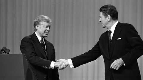 President Jimmy Carter shakes hands with Republican opponent Ronald Reagan after their debate on  October 28, 1980, in Cleveland, Ohio. White evangelicals, after supporting Carter in 1976, drifted to Reagan in the 1980 campaign.