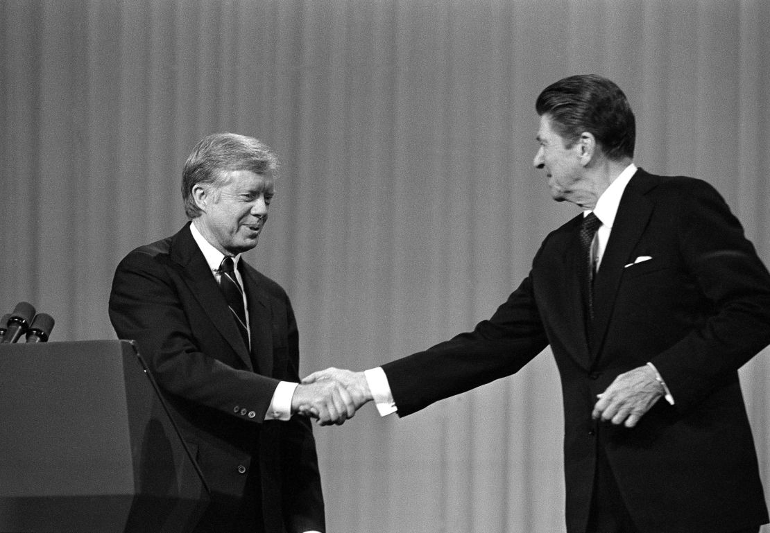 President Jimmy Carter shakes hands with Republican opponent Ronald Reagan after their debate on  October 28, 1980, in Cleveland, Ohio. White evangelicals, after supporting Carter in 1976, drifted to Reagan in the 1980 campaign.