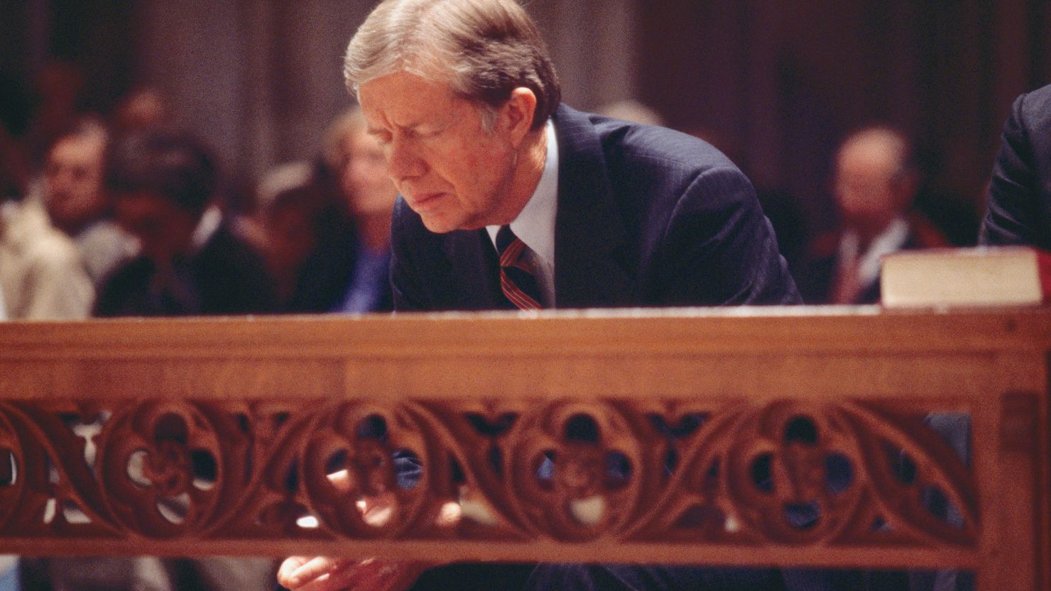 President Jimmy Carter bows during a prayer service for the hostages being held in Iran on November 15, 1979, at the National Cathedral in Washington.