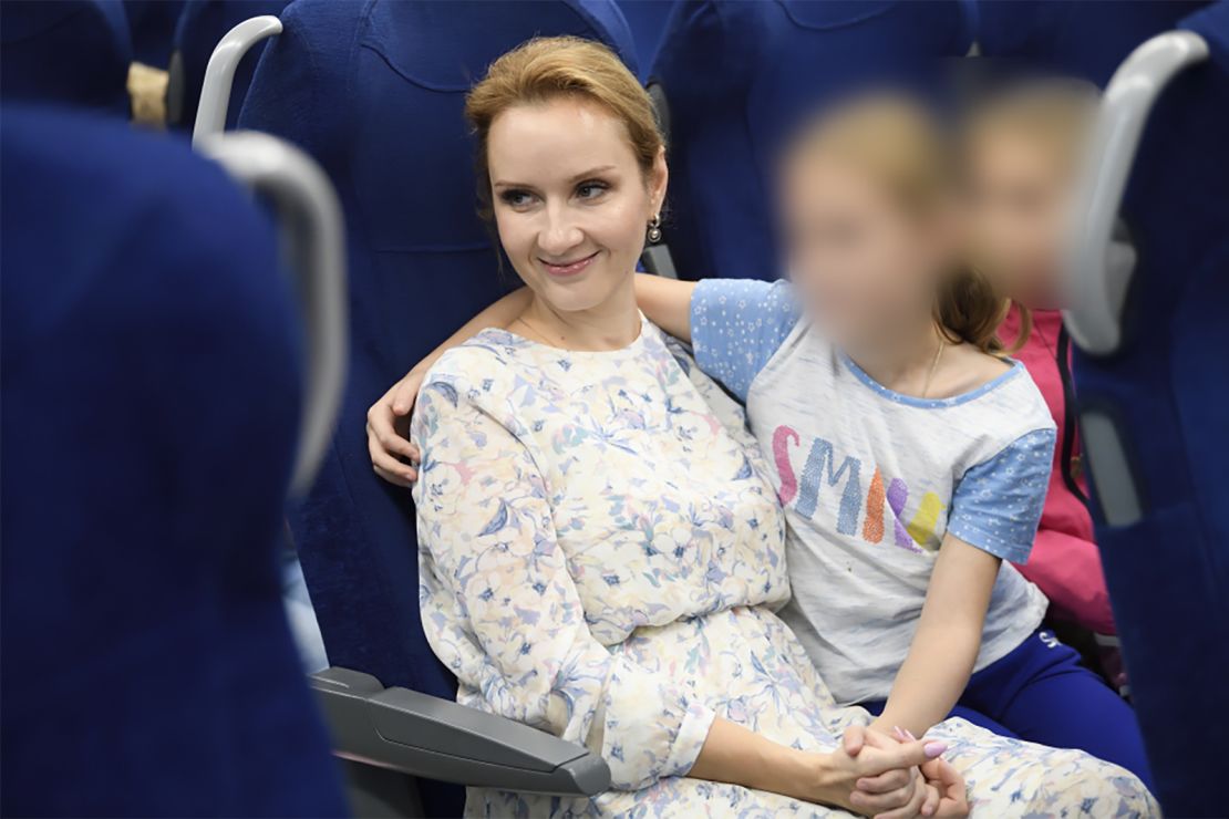 Russia's Commissioner for Children's Rights Maria Lvova-Belova pictured with what her office said are orphans from Donbas who have been sent to Russia's Nizhny Novgorod region. The image was released by Lvova-Belova's office in September. CNN obscured portions of this image to protect the identity of the children.