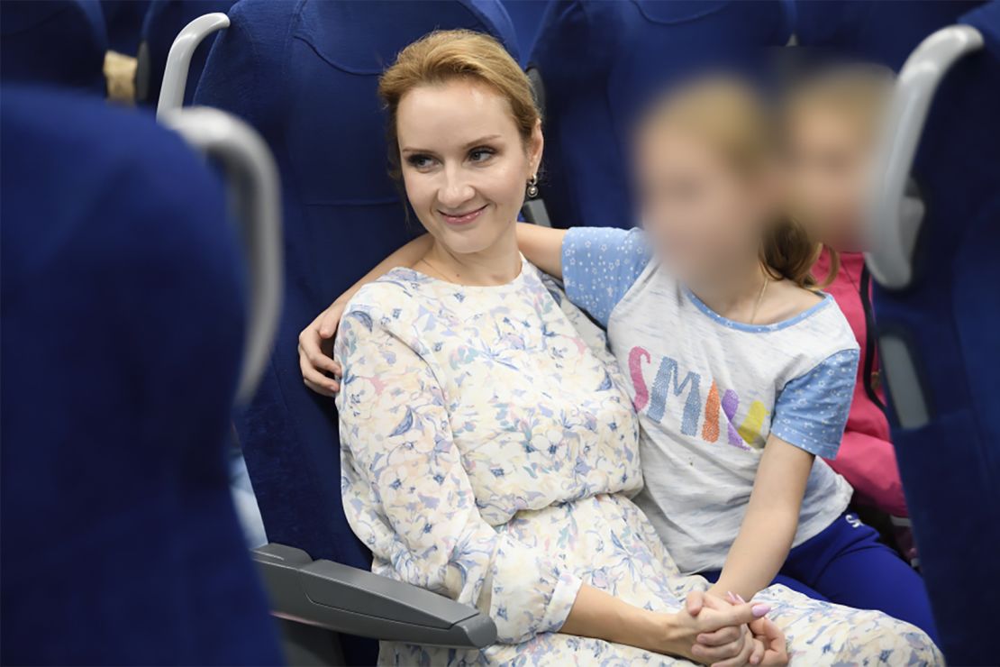 Russia's Commissioner for Children's Rights Maria Lvova-Belova pictured with what her office said are orphans from Donbas who have been sent to Russia's Nizhny Novgorod region. The image was released by Lvova-Belova's office in September. CNN obscured portions of this image to protect the identity of the children. 