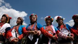 Women from the Tsou aboriginal tribe join hands and sing during the "Mayasvi" war ceremony in the village of Tefuye in Alishan March 1, 2008.
