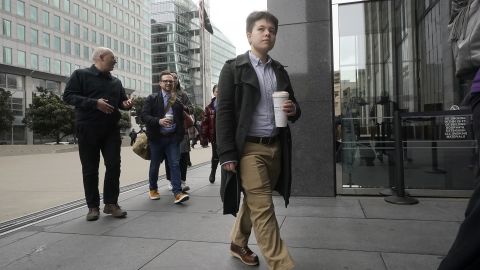 Former Twitter employee Justine De Caires walks toward an entrance to a federal courthouse in San Francisco, Thursday, Dec. 8, 2022. De Caires is one of the former Twitter employees taking legal action against the company following mass layoffs after Musk took over.