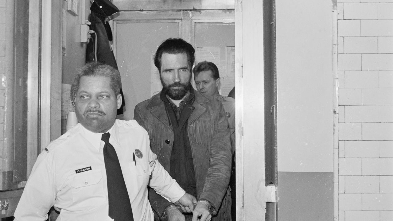 Gary Heidnik, known as the "House of Horrors" killer, is escorted to court in early 1987 in Philadelphia. 