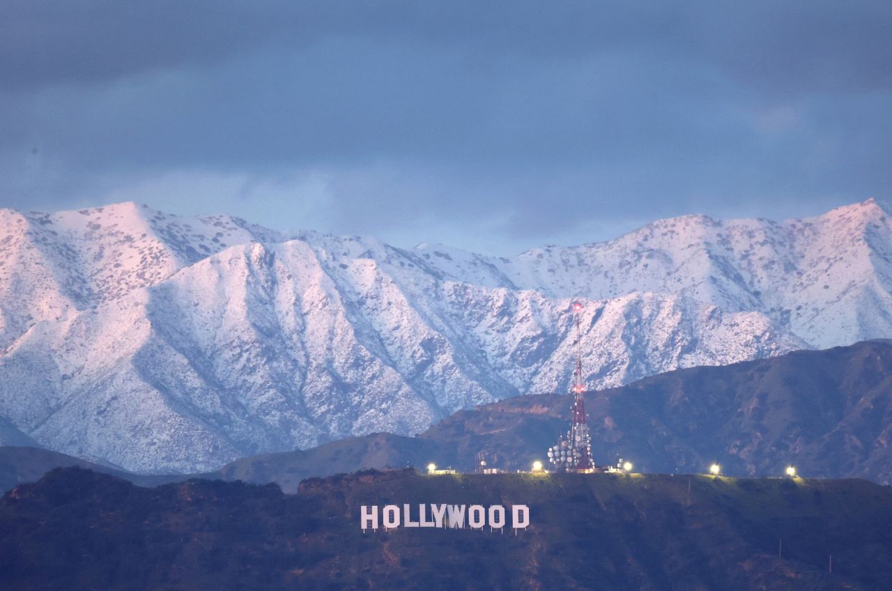 Snow-covered mountains rise above the Hollywood sign in Los Angeles, on Wednesday, March 1. A rare blizzard warning was in effect for parts of southern California and Los Angeles County this past weekend, as a winter storm dumped massive amounts of precipitation across the region.