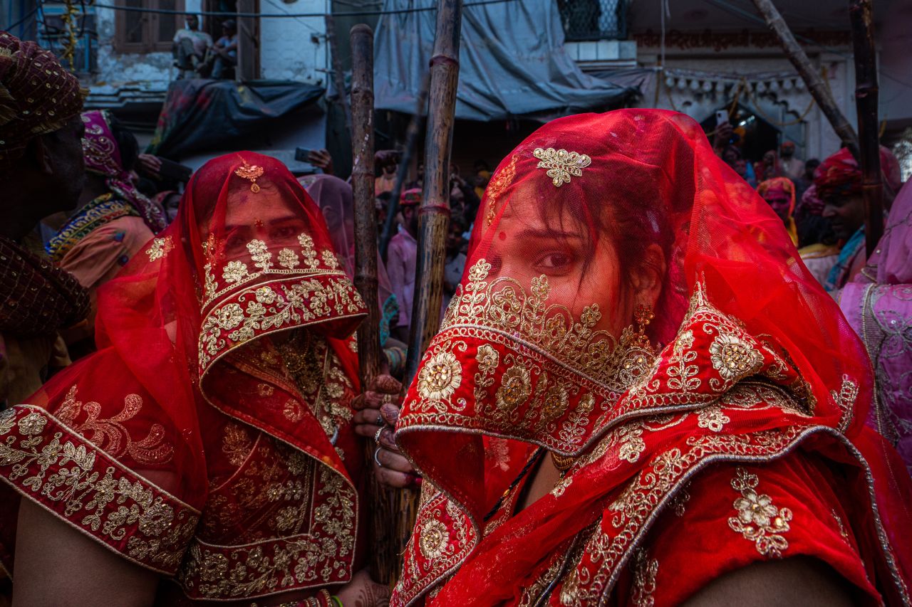 People gather to celebrate Lathmar Holi in Barsana, India, on Tuesday, February 28.