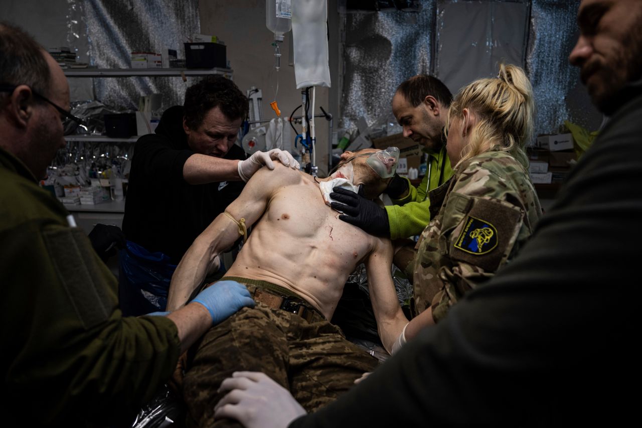 Ukrainian military medics treat a wounded solider at a field hospital near Bakhmut, Ukraine, on Sunday, February 26.