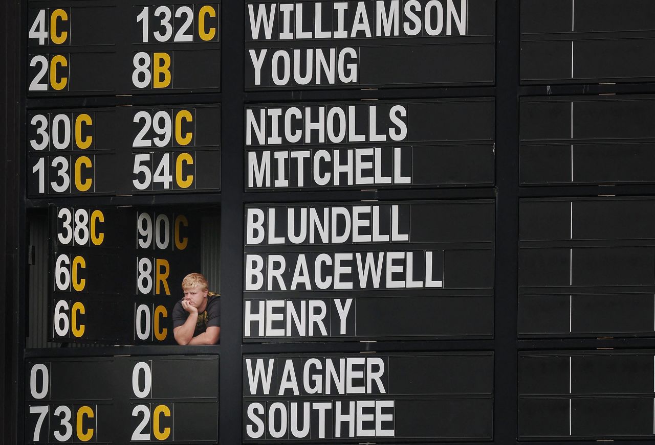A scorekeeper watches a cricket match between New Zealand and England from inside the scoreboard in Wellington, New Zealand on Monday, February 27.