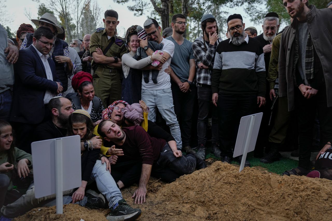 Family members and friends of Israeli settlers Hillel Menachem Yaniv, 21, and Yagel Yaakov Yaniv, 19, mourn during their funeral at Israel's national cemetery in Jerusalem on Monday, February 27. The brothers were <a href="https://www.cnn.com/2023/02/26/middleeast/west-bank-violence-intl/index.html" target="_blank">shot and killed Sunday</a> in the Israeli-occupied West Bank town of Hawara.