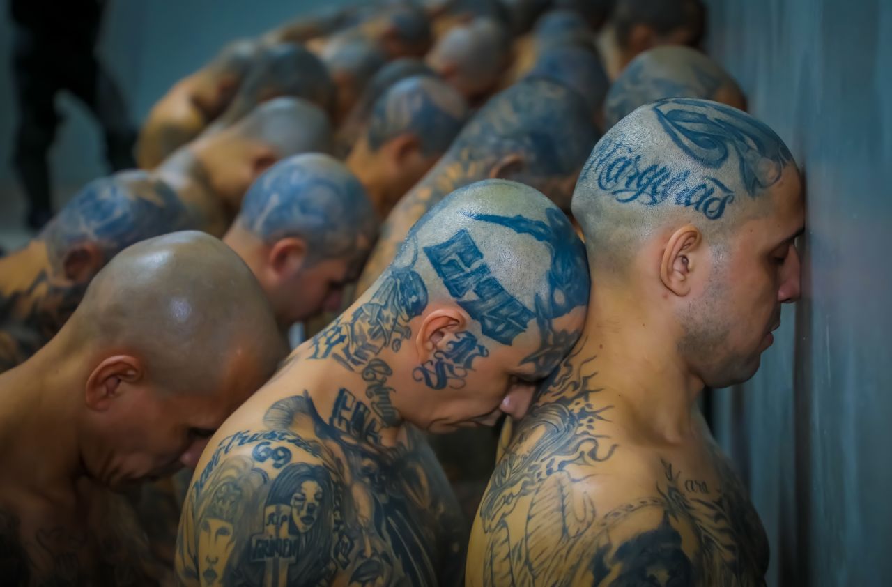 Inmates arrive at a prison in Tecoluca, El Salvador, on Saturday, February 25. The first group of 2,000 suspected gang members in El Salvador has been moved to a huge new prison, the centerpiece of President Nayib Bukele's self-declared war on crime.