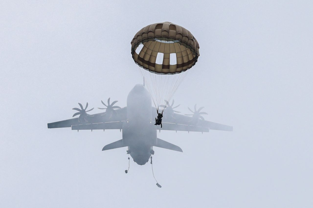 A French paratrooper parachutes from an aircraft during a large-scale military drill in Castres, France, on Saturday, February 25.