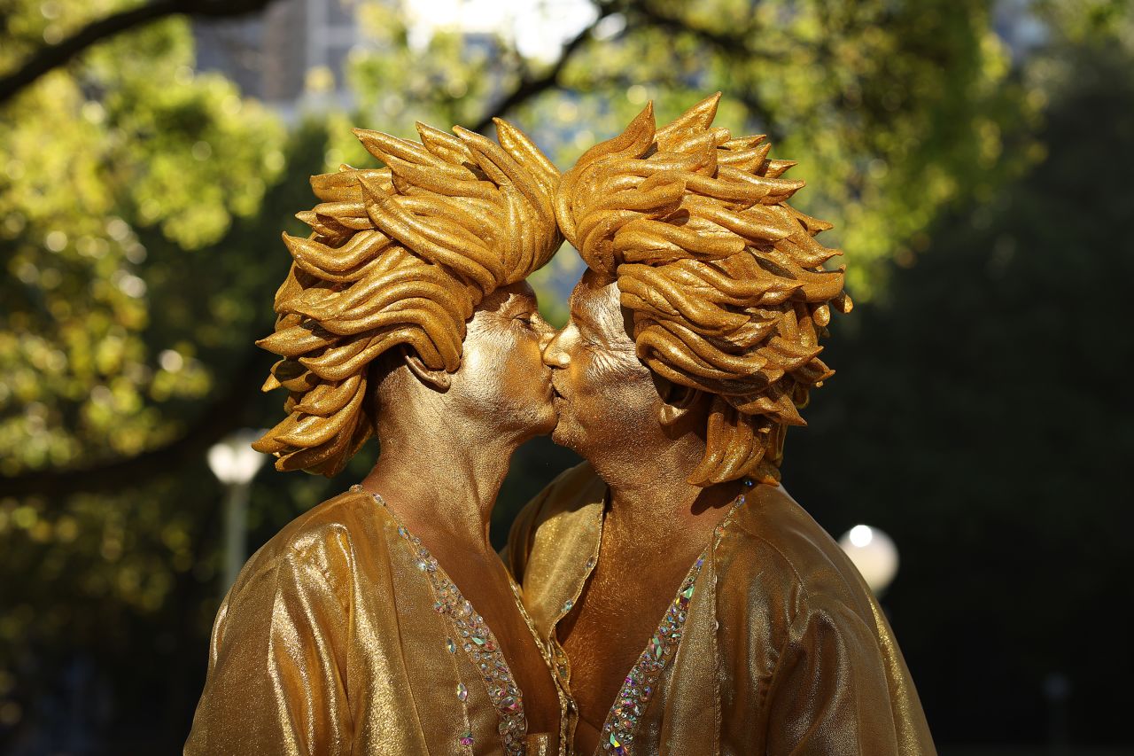 Revelers kiss ahead of the Sydney Gay and Lesbian Mardi Gras Parade on Saturday, February 25, in Sydney, Australia.