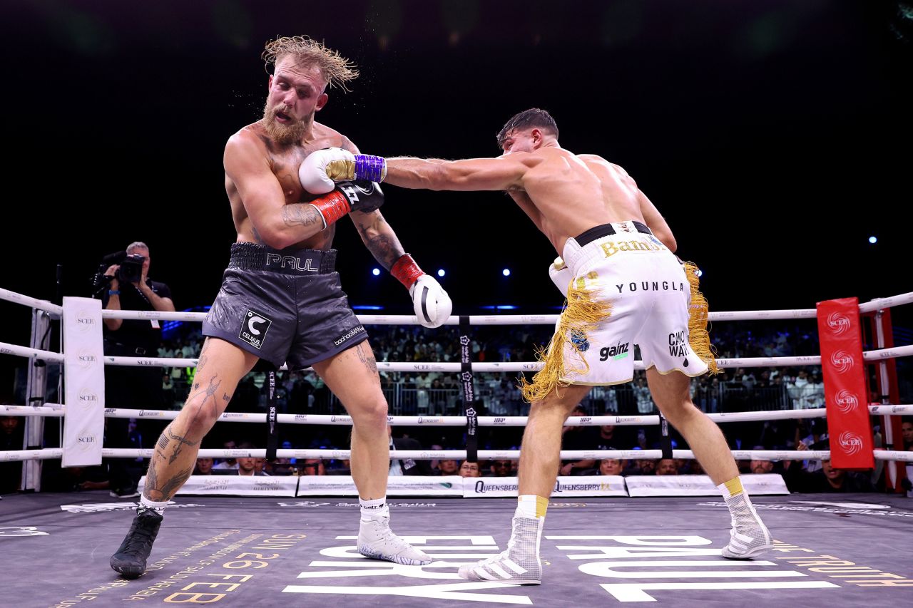 Tommy Fury punches Jake Paul during their title fight at the Diriyah Arena in Riyadh, Saudi Arabia, on Sunday, February 26. Paul suffered the first defeat of his fledgling boxing career as Fury, a boxer-turned reality TV star, edged him out in a split decision.