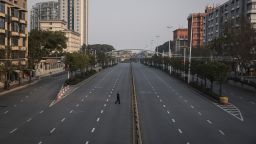 A man crosses an empty highway on February 3, 2020 in Wuhan, China amid a Covid-19 lockdown at the start of the pandemic.