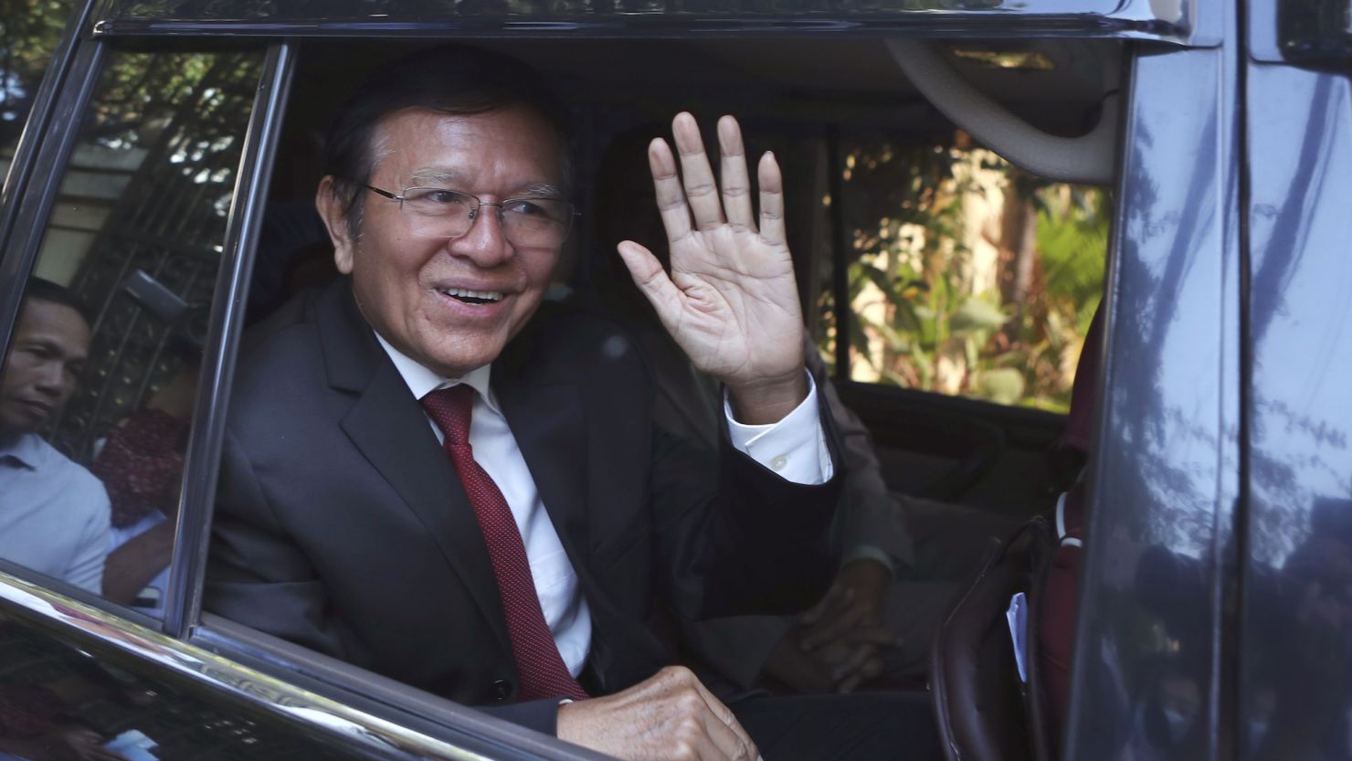 Former President of Cambodia National Rescue Party, Kem Sokha, waves from his car in front of his house in Phnom Penh, Cambodia, Friday, March 3, 2023. 