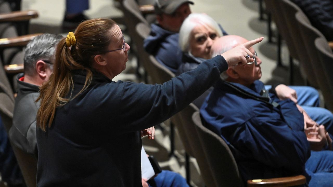 A woman points her finger during a town hall held by the U.S. Environmental Protection Agency (EPA), in East Palestine, Ohio, U.S., March 2, 2023.  REUTERS/Alan Freed