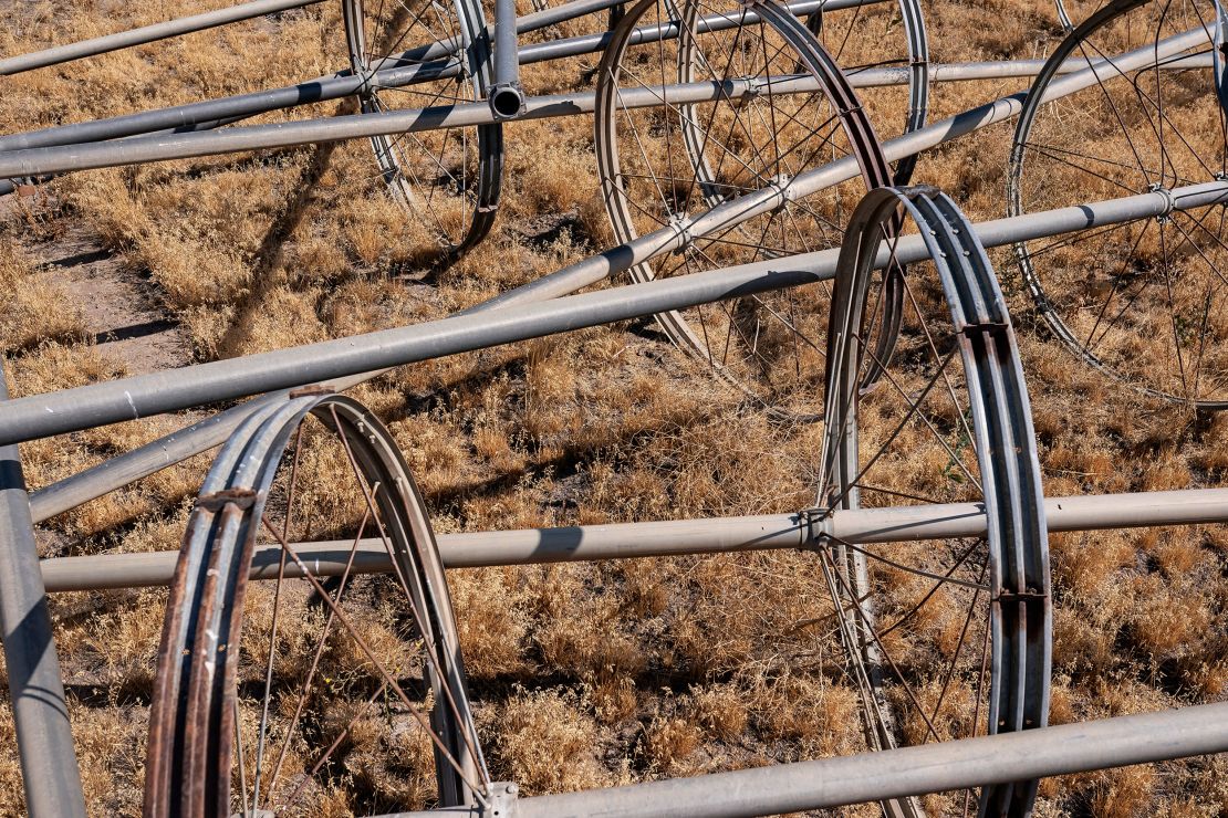 Dry and inactive irrigation pipes are stored in a fallowed field in the North Unit Irrigation District near Madras, Oregon, in August 2021.