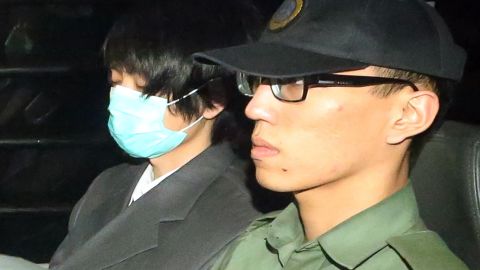 Henry Chau Hoi-leung, who murdered and dismembered his parents, is escorted from the Hong Kong High Court on March 20, 2015.