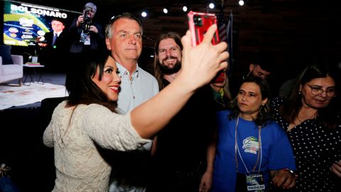 Bolsonaro poses for a selfie during an event at a restaurant at Dezerland amusement park in Orlando, Florida, U.S. January 31, 2023.